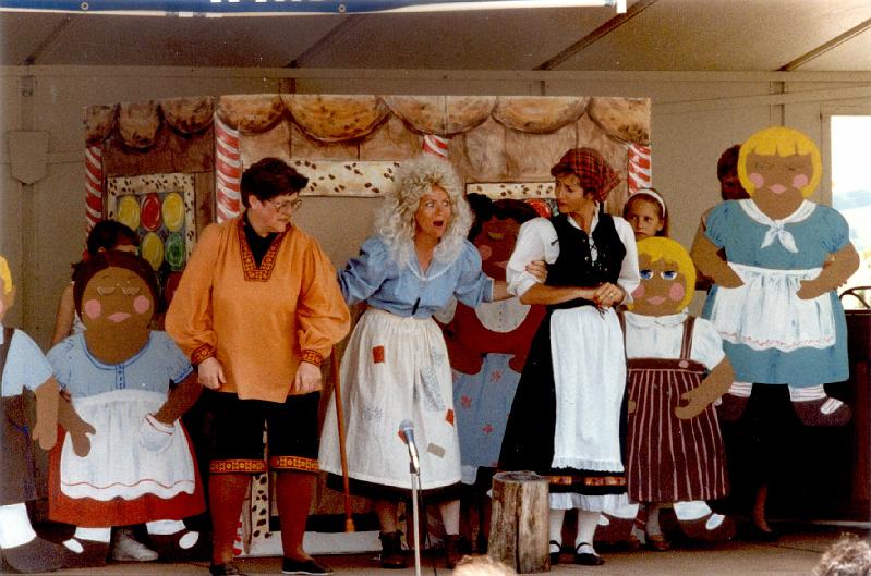 MiS01.jpg - Hansel and Gretel with the witch 
Left to right: Kathy Guyette (Hansel), Pam Grove (the witch), and Marsha Sweeney (Gretel).  The witch has turned children from the audience into  "cookie children".  At the end of the play, the cookie children are brought back to life.
